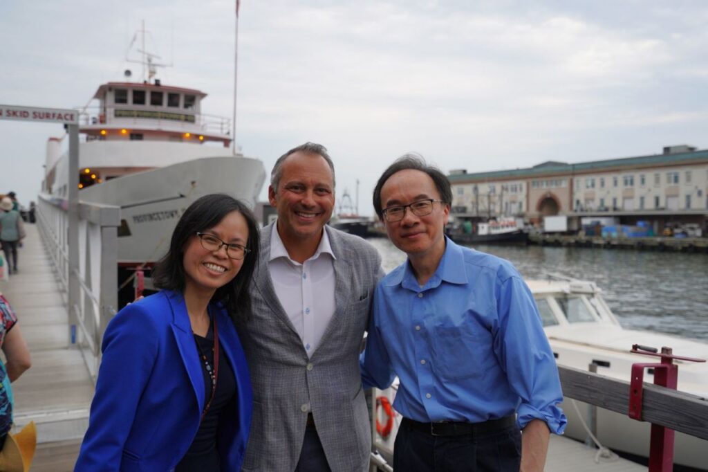 In front of ship for AAPI Cruise, AAPIC staff Anita Yip, Representative Aaron Michlewitz, and AAPIC's first Executive Director (currently Commonwealth Seminar Executive Director)